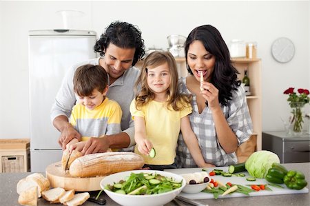 simsearch:400-04206231,k - Jolly family preparing lunch together in the kitchen Stock Photo - Budget Royalty-Free & Subscription, Code: 400-04195257