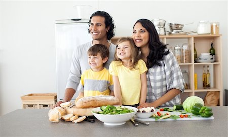 simsearch:400-04206231,k - Merry family preparing lunch together in the kitchen Stock Photo - Budget Royalty-Free & Subscription, Code: 400-04195259