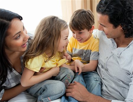simsearch:400-04192370,k - Close-up of family having fun on sofa  in the living room Stock Photo - Budget Royalty-Free & Subscription, Code: 400-04195289