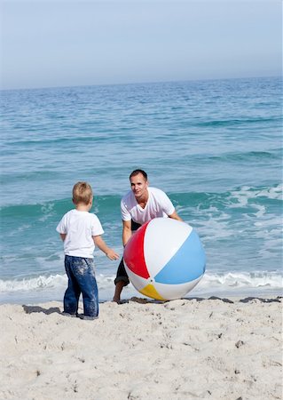 simsearch:400-04114591,k - Joyful father and his son playing with a ball at the beach Stock Photo - Budget Royalty-Free & Subscription, Code: 400-04195329