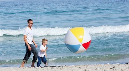 simsearch:400-04221909,k - Jolly Father and his son having fun at the beach Stock Photo - Budget Royalty-Free & Subscription, Code: 400-04195338
