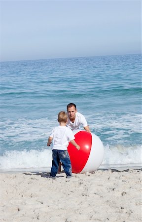 simsearch:400-04221909,k - Happy father and his son playing with a ball at the beach Stock Photo - Budget Royalty-Free & Subscription, Code: 400-04195344