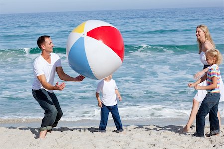 simsearch:400-04114591,k - Lively family playing with a ball at the beach Stock Photo - Budget Royalty-Free & Subscription, Code: 400-04195342