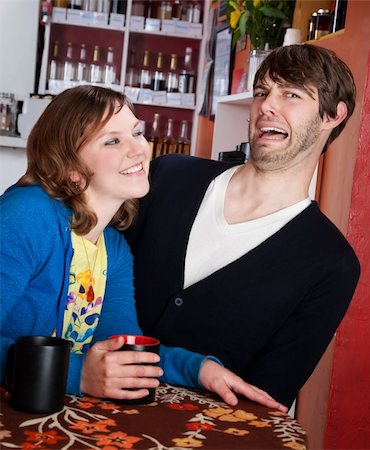 Shy man recoils from aggressive woman in a coffee house Stock Photo - Budget Royalty-Free & Subscription, Code: 400-04195540