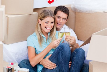 simsearch:400-04663577,k - Cheerful couple toasting with Champagne after move in Stock Photo - Budget Royalty-Free & Subscription, Code: 400-04195950