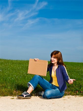 people scenic view sky hiking summer - Young woman hitch hiking on a beautiful green meadow Stock Photo - Budget Royalty-Free & Subscription, Code: 400-04196123