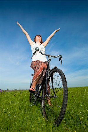 simsearch:400-04201795,k - Happy young woman relaxing over a vintage bicycle Fotografie stock - Microstock e Abbonamento, Codice: 400-04196135