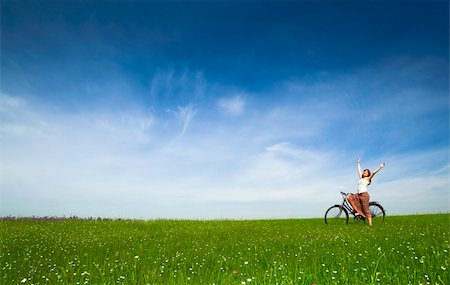 simsearch:400-04201795,k - Happy young woman with a vintage bicycle on a green meadow Stock Photo - Budget Royalty-Free & Subscription, Code: 400-04196132