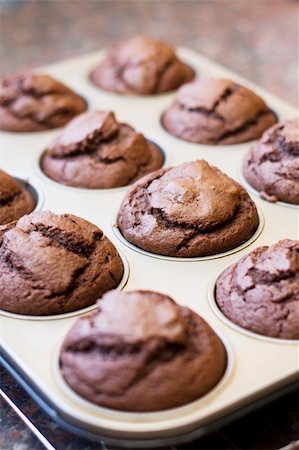 Twelve freshly baked chocolate muffins cooling off Stock Photo - Budget Royalty-Free & Subscription, Code: 400-04196590