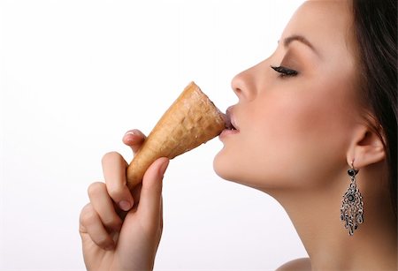 side lips view pictures - attractive young adult eating ice-cream on white Stock Photo - Budget Royalty-Free & Subscription, Code: 400-04196683
