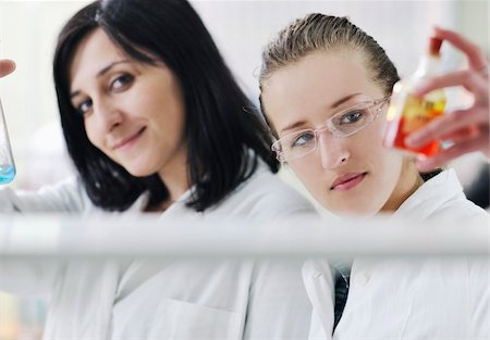 simsearch:400-05218769,k - young woman students group in bright chemistry  lab Stock Photo - Budget Royalty-Free & Subscription, Code: 400-04196729