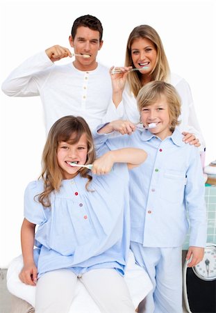 Jolly family brushing their teeth  in the bathroom Stock Photo - Budget Royalty-Free & Subscription, Code: 400-04196889