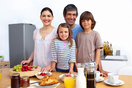 Happy family having a breakfast in the kitchen Stock Photo - Budget Royalty-Free & Subscription, Code: 400-04196953