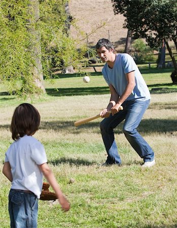 Athletic father playing baseball with his son in the park Stock Photo - Budget Royalty-Free & Subscription, Code: 400-04197009