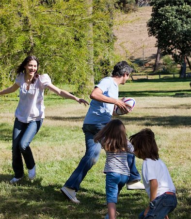 Animated family playing rugby in a park Stock Photo - Budget Royalty-Free & Subscription, Code: 400-04197022