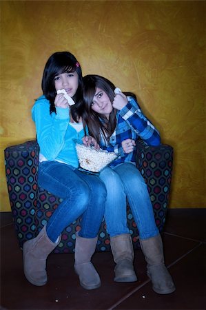 sibling sad - Hispanic girls with popcorn watching something sad on television Stock Photo - Budget Royalty-Free & Subscription, Code: 400-04197132