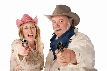 Couple in western wear pointing pistols and laughing Stock Photo - Budget Royalty-Free & Subscription, Code: 400-04197199