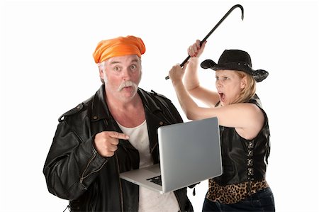funny faces of old people - Woman with crowbar threatening man looking at something risque on laptop computer Stock Photo - Budget Royalty-Free & Subscription, Code: 400-04197207