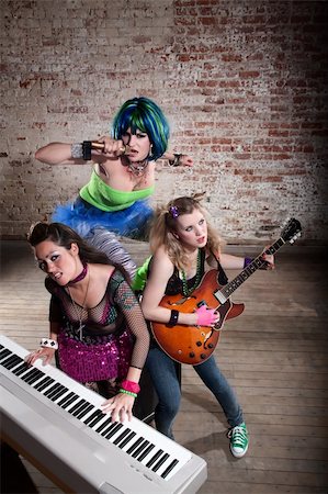 piano performance dress - Young all girl punk rock band performing Stock Photo - Budget Royalty-Free & Subscription, Code: 400-04197219