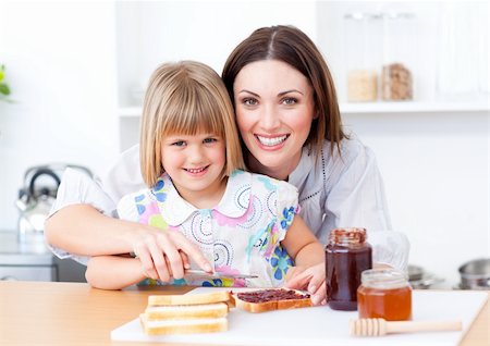 simsearch:400-04206231,k - Adorable little girl and her mother preparing toasts in the kitchen at home Stock Photo - Budget Royalty-Free & Subscription, Code: 400-04197457