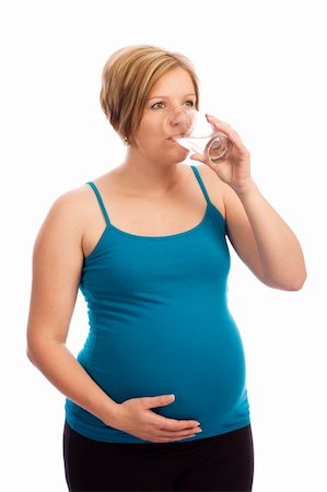 Healthy pregnant Caucasian woman drinking water out of a glass Stock Photo - Budget Royalty-Free & Subscription, Code: 400-04197497