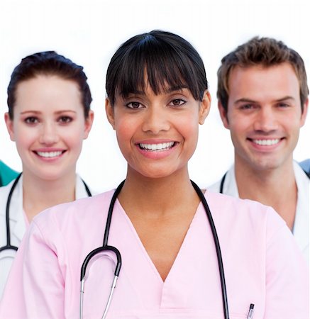 Portrait of a doctor and her medical team against a white background Photographie de stock - Aubaine LD & Abonnement, Code: 400-04197792