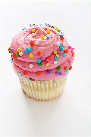 simsearch:400-04178778,k - Cupcake with pink frosting and sprinkles vertical Foto de stock - Super Valor sin royalties y Suscripción, Código: 400-04197963