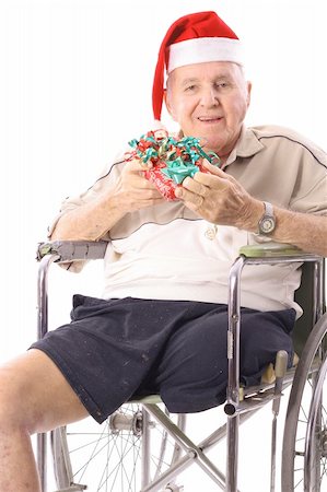 simsearch:400-05147195,k - eldery man in wheelchair celebrating christmas vertical Stock Photo - Budget Royalty-Free & Subscription, Code: 400-04197978