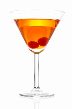 Stock image of Manhattan cocktail on martini glass with Maraschino Cherries over white background Stock Photo - Budget Royalty-Free & Subscription, Code: 400-04198104