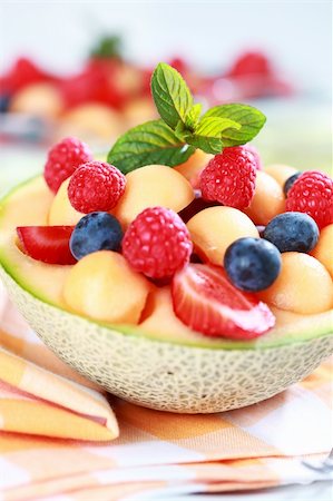 Delicious fresh fruits served in melon bowl as dessert Photographie de stock - Aubaine LD & Abonnement, Code: 400-04198188