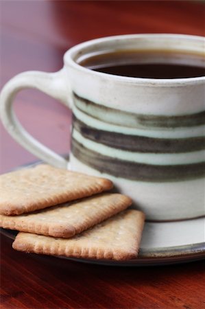 simsearch:625-00803005,k - Healthy biscuits and a cup of coffee. Focus on biscuits Photographie de stock - Aubaine LD & Abonnement, Code: 400-04198221