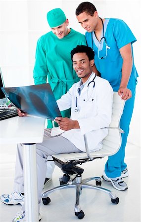 surgical team - Positive male doctors looking at X-Ray in hospital Stock Photo - Budget Royalty-Free & Subscription, Code: 400-04198247