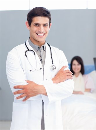 simsearch:400-04281577,k - Portrait of a smiling doctor at the hospital Photographie de stock - Aubaine LD & Abonnement, Code: 400-04198268