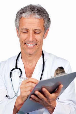 Doctor writting documents and carrying a stethoscope Stock Photo - Budget Royalty-Free & Subscription, Code: 400-04198461
