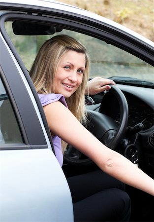 Young female driver at the wheel in her new car Stock Photo - Budget Royalty-Free & Subscription, Code: 400-04198628