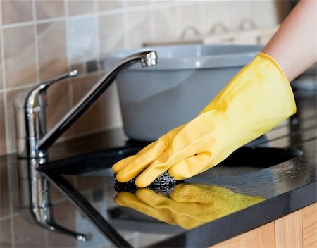 Close-up of a woman cleaning a kitchen at home Stock Photo - Budget Royalty-Free & Subscription, Code: 400-04198640