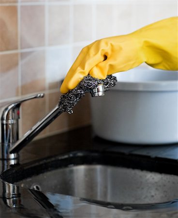 Close-up of a person cleaning a kitchen at home Stock Photo - Budget Royalty-Free & Subscription, Code: 400-04198642