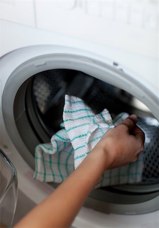 Close-up of a woman doing laundry at home Photographie de stock - Aubaine LD & Abonnement, Code: 400-04198652