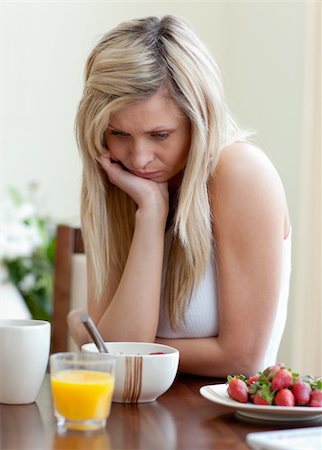 simsearch:400-04708507,k - Tired woman having an healthy breakfast at home Stock Photo - Budget Royalty-Free & Subscription, Code: 400-04198662