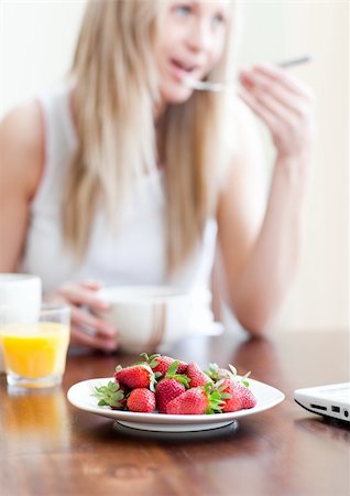 simsearch:400-04708507,k - Cute woman having an healthy breakfast in a living-room Stock Photo - Budget Royalty-Free & Subscription, Code: 400-04198678