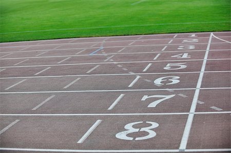 athletics race track finish lane on soccer stadium Stock Photo - Budget Royalty-Free & Subscription, Code: 400-04198792