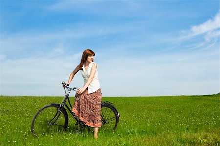 simsearch:400-04201795,k - Young woman with a vintage bicycle on a green meadow Stock Photo - Budget Royalty-Free & Subscription, Code: 400-04198829