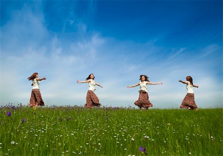 Same young woman in diferent positions dancing on a beautiful green meadow Stock Photo - Budget Royalty-Free & Subscription, Code: 400-04198842