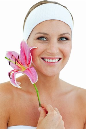 simsearch:400-05663148,k - Charning woman holding a flower against a white background Photographie de stock - Aubaine LD & Abonnement, Code: 400-04198883