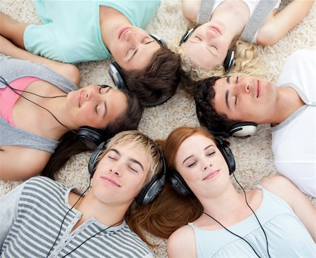 High angle of young Teenagers listening to music Stock Photo - Budget Royalty-Free & Subscription, Code: 400-04199108