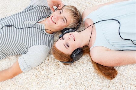 Couple of young Teenagers listening to music Stock Photo - Budget Royalty-Free & Subscription, Code: 400-04199100