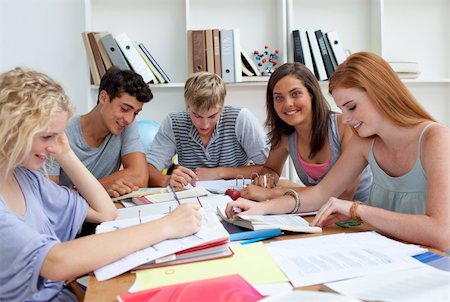 simsearch:400-04841324,k - Smiling teenagers studying in the library. Concept of education Photographie de stock - Aubaine LD & Abonnement, Code: 400-04199251