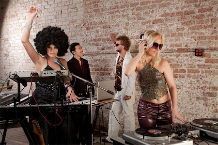 rock band four men - Female DJs performing at a 1970s Disco Music Party Stock Photo - Budget Royalty-Free & Subscription, Code: 400-04199613