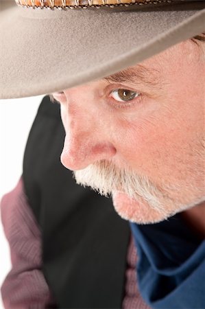 simsearch:400-04181720,k - Close-up of older man in western outfit and hat Foto de stock - Royalty-Free Super Valor e Assinatura, Número: 400-04199628