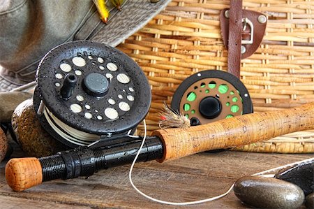 fishing bait - Closeup of fly fishing rod with equipment Stock Photo - Budget Royalty-Free & Subscription, Code: 400-04199664